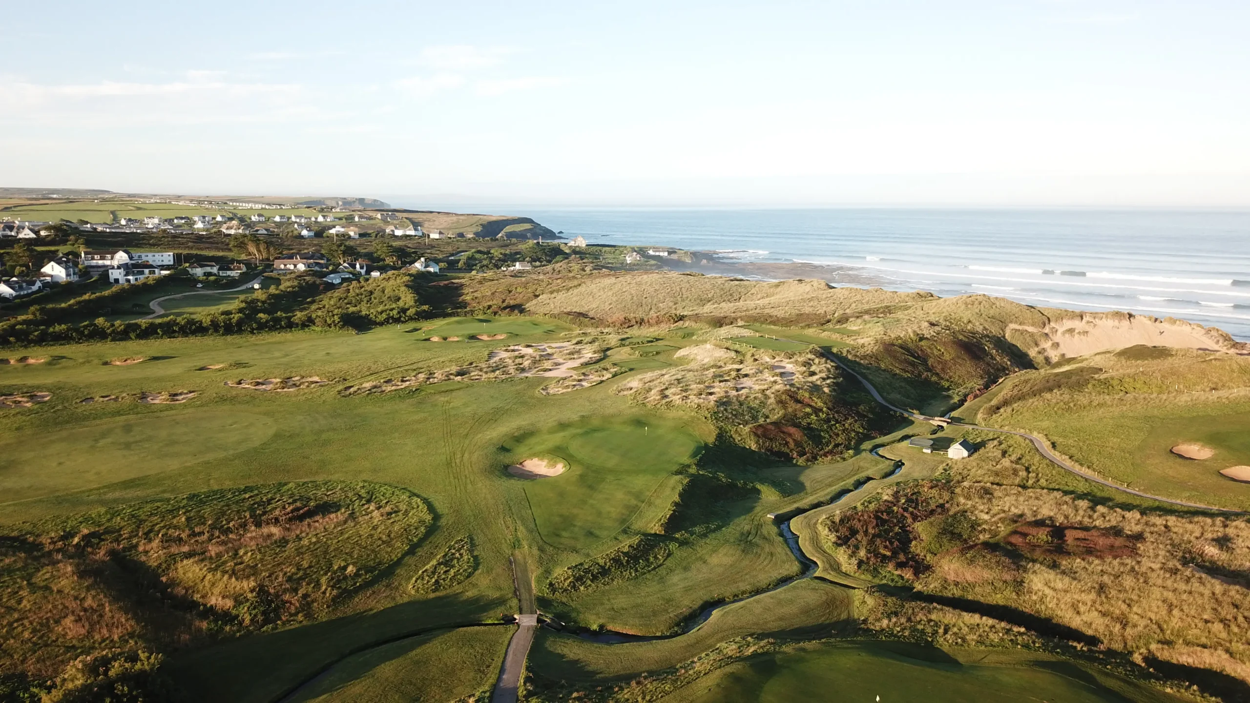 Championship Golf Course in Cornwall with lush green fairways overlooking the rugged coastline.