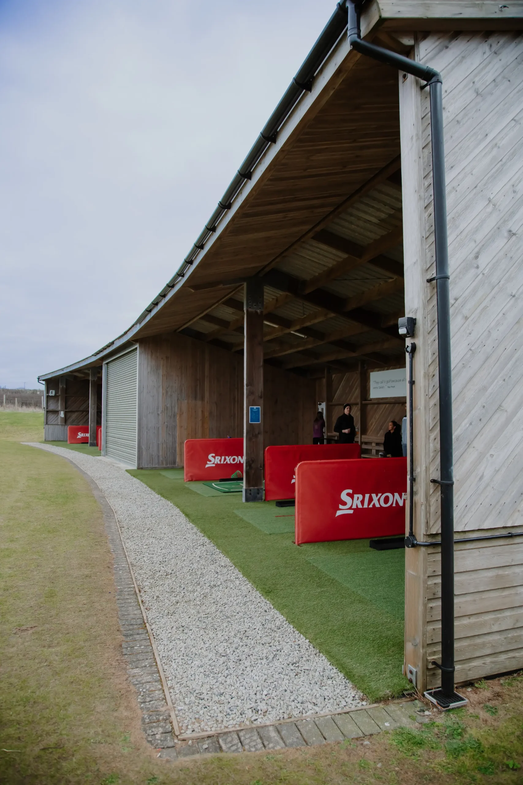 Covered driving range with practice bays at a Cornwall golf course.