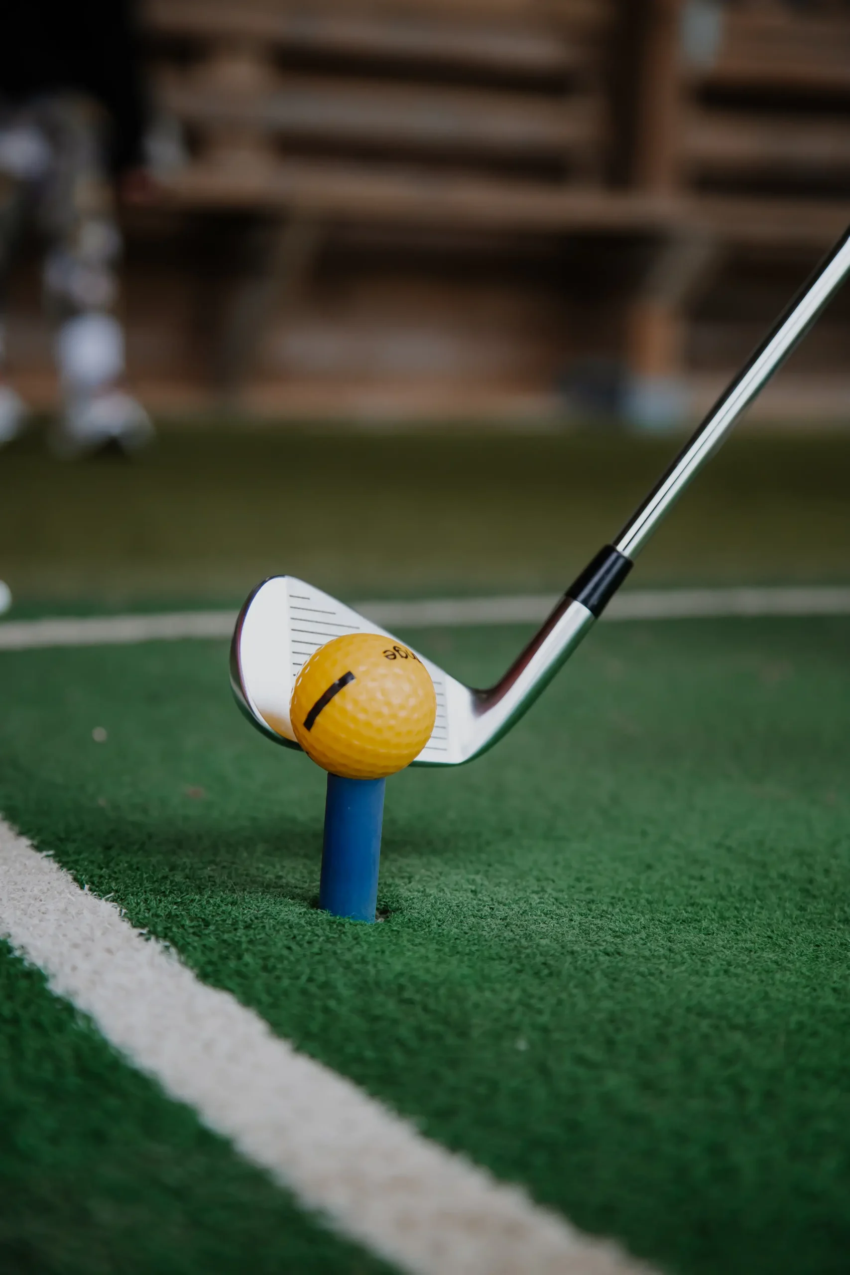 Golfer practising at Trevose Driving Range in Cornwall, part of the ultimate golf performance centre.
